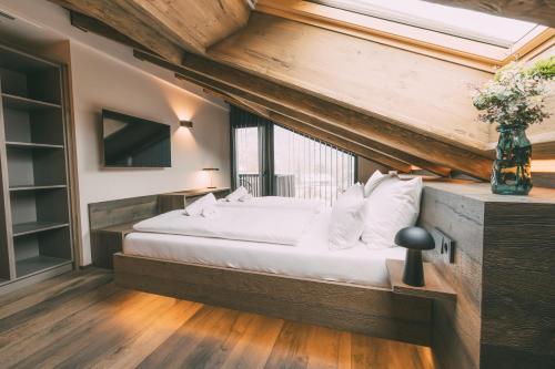 Ένα ή περισσότερα κρεβάτια σε δωμάτιο στο LIVALPIN Chalet