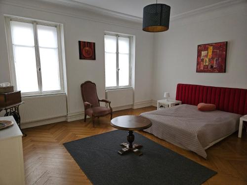 Postel nebo postele na pokoji v ubytování Maison de Maitre à Koenigshoffen