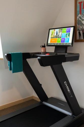 a treadmill desk with a computer on it at Panocek i Babka in Białka Tatrzanska