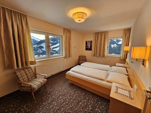 Postel nebo postele na pokoji v ubytování Berggasthaus Steinerkogl