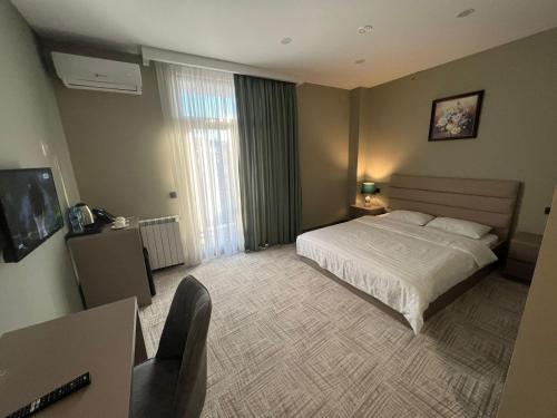 Postel nebo postele na pokoji v ubytování Caspian VF Hotel