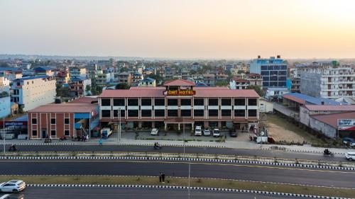 a building on the side of a road in a city at Chitwan Midtown Hotel in Bharatpur