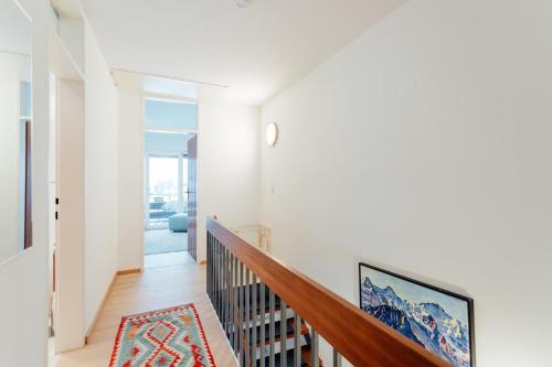 a staircase in a home with white walls at Haus MARGOT by MoniCare in Seefeld in Tirol