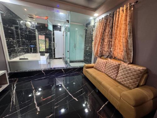 a living room with a couch and a bathroom at Villa 5152 Panvel in Vajapūr