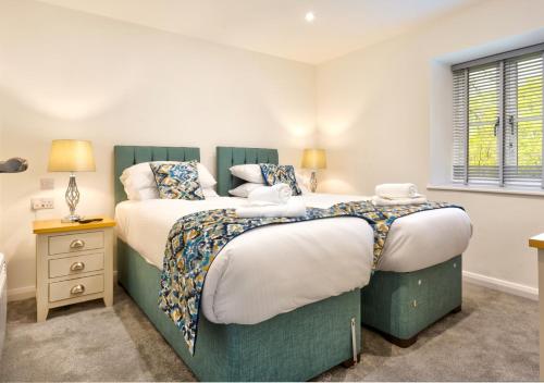 Postel nebo postele na pokoji v ubytování Lily of the Valley