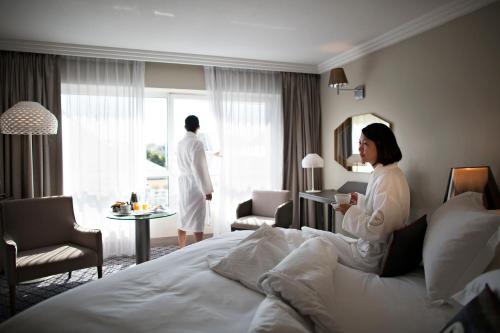 Postel nebo postele na pokoji v ubytování Célestins Spa Thermal & Hôtel by Vy Resort