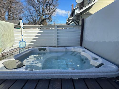 a jacuzzi tub sitting on top of a deck at Best EWR Airport Apt-Hot Tub-Free Parking in Hillside