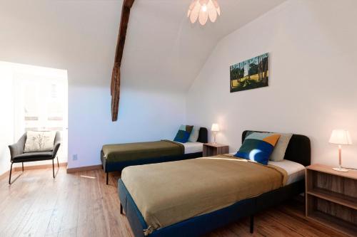 Giường trong phòng chung tại La Caulnaise - Maison climatisée avec terrasse