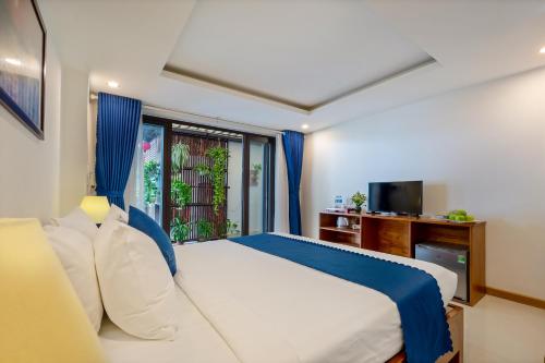 Sands River Hoi An Villaにあるテレビまたはエンターテインメントセンター