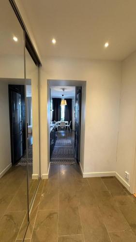 a hallway with a dining room and a living room at Cozy and central apartment in Gothenburg