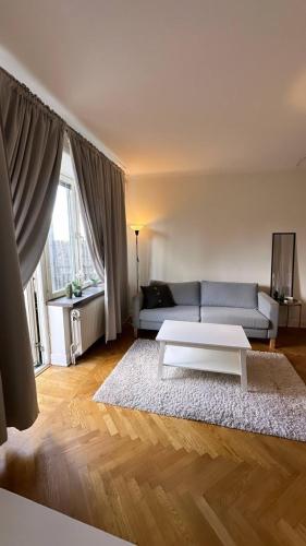 a living room with a couch and a coffee table at Cozy and central apartment in Gothenburg