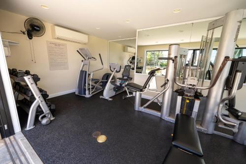 a gym with several treadmills and machines in a room at Elua 406 in Wailea