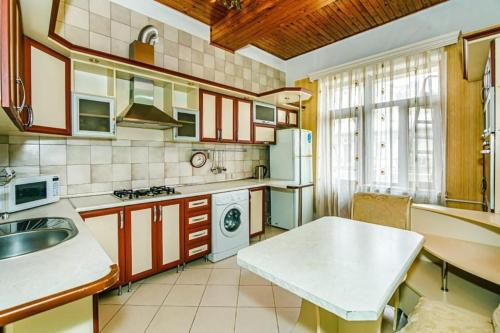a kitchen with a sink and a table in it at Pandora in Baku