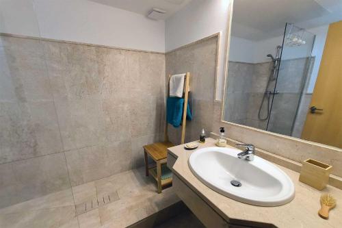 a bathroom with a sink and a shower at Albatros in Casares