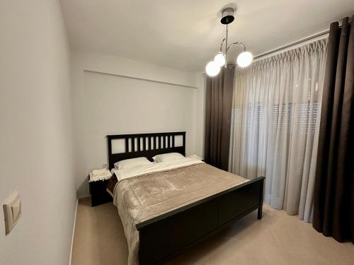 Posteľ alebo postele v izbe v ubytovaní REM Apartments