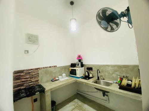 Kuchyň nebo kuchyňský kout v ubytování Orana Villa