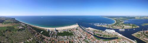an aerial view of a city and a river at Ostseehotel Warnemünde in Warnemünde