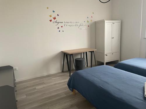 Ένα ή περισσότερα κρεβάτια σε δωμάτιο στο La Casa di Mimmi