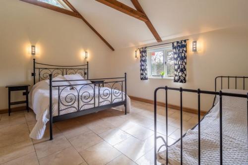 a bedroom with a bed and a window at Moles Meadow 4 in Middleton