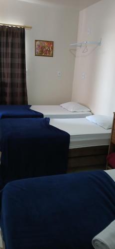 Ένα ή περισσότερα κρεβάτια σε δωμάτιο στο Hotel Rafael