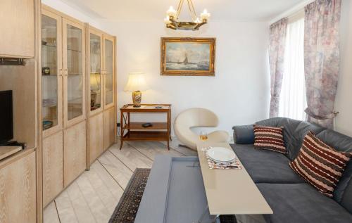a living room with a couch and a table at Nice Sea View Elegant Apartment in Athens