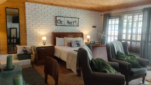 Ένα ή περισσότερα κρεβάτια σε δωμάτιο στο Tranquility Guest House