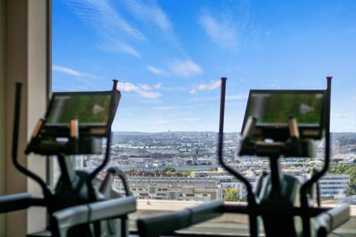 a view of a city from a window at HANS-Y Apartments inklusive Outdoorpool & Bar in Vienna