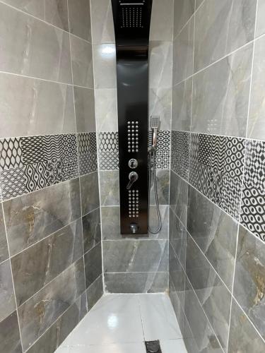 a bathroom with a shower with a toilet in it at Aseel bedoul in Petra