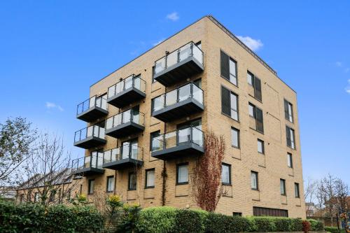 an apartment building with balconies on the side of it at Hybrid Resi - London, Greenwich near O2 Arena in London