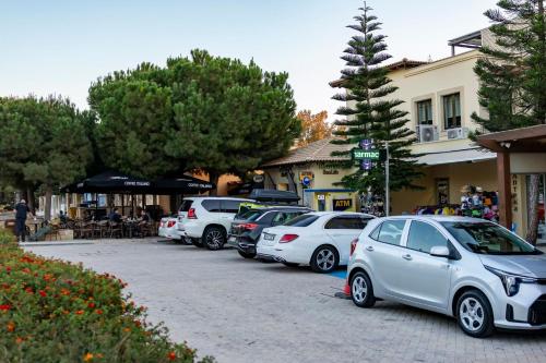 a row of cars parked in a parking lot at HG07 Adjacent to Aphrodite Hills- Private Pool, Large Terrace in Kouklia