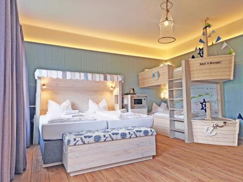 Postel nebo postele na pokoji v ubytování Wangerland Resort