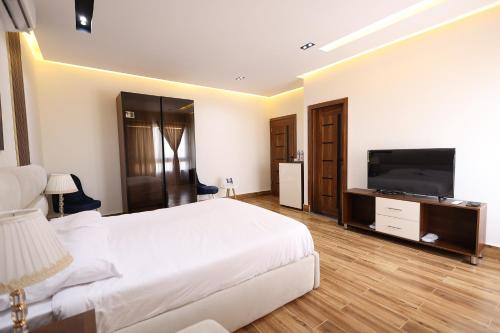 Μια τηλεόραση ή/και κέντρο ψυχαγωγίας στο SOLAYA Sunshine inn