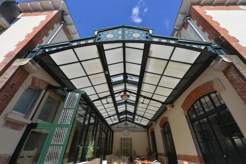 awning over the entrance to a building at Hotel Castel Jeanson in Ay