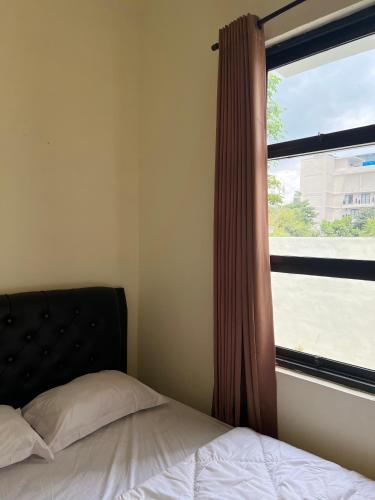 Postel nebo postele na pokoji v ubytování Jojo's Villa Batu