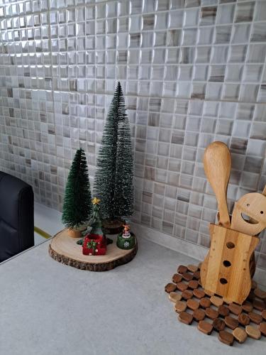 a table with some christmas decorations on it at Tei Residence in Piatra Neamţ