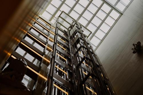 a tall building with windows in a building at Hotel Arconte, Adults Only in Barcelona