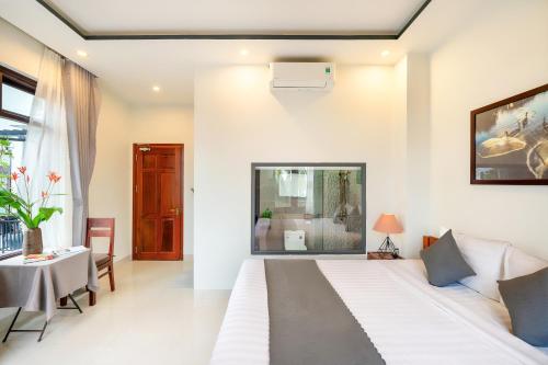 Sands River Hoi An Villaにあるベッド