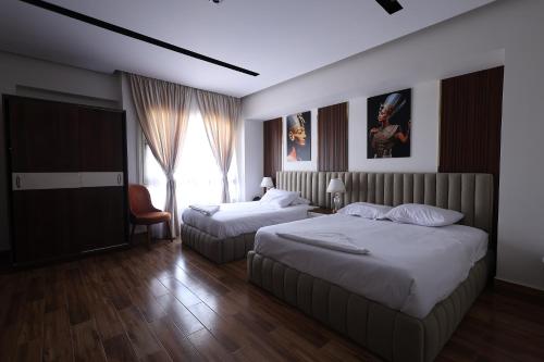 Ένα ή περισσότερα κρεβάτια σε δωμάτιο στο SOLAYA Sunshine inn