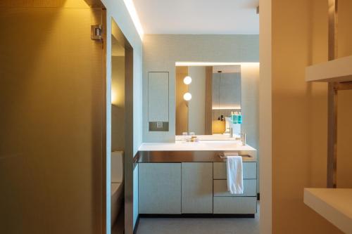 a bathroom with a sink and a mirror at Hotel Arconte, Adults Only in Barcelona