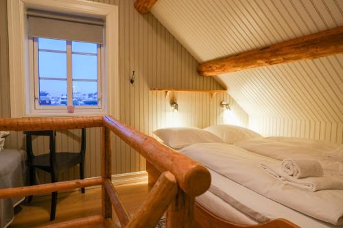 Postel nebo postele na pokoji v ubytování Mini Apartment Sakrisøy