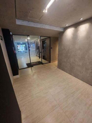 an empty room with a large room with a room at Get By Side in João Pessoa