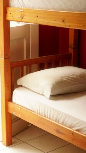 two bunk beds in a room with a mirror at POA Eco Hostel in Porto Alegre