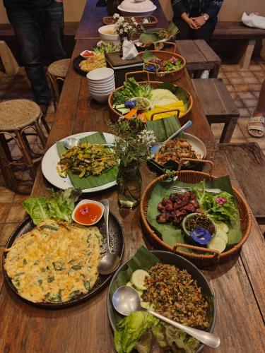 a table with many plates of food on it at U Garden in Ban Huai Khai