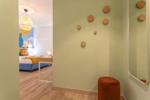 a room with a wall with rocks on the wall at Le Muse Suites in Rome