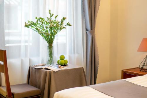 Sands River Hoi An Villaにあるベッド