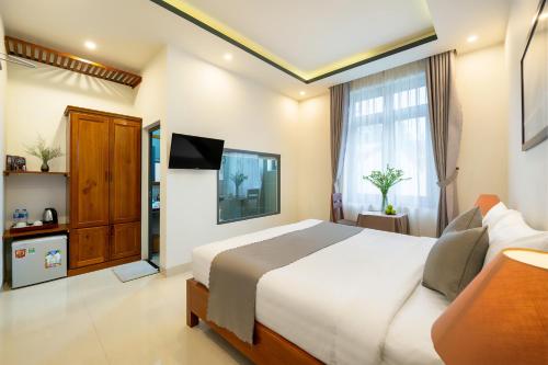 Sands River Hoi An Villaにあるベッド