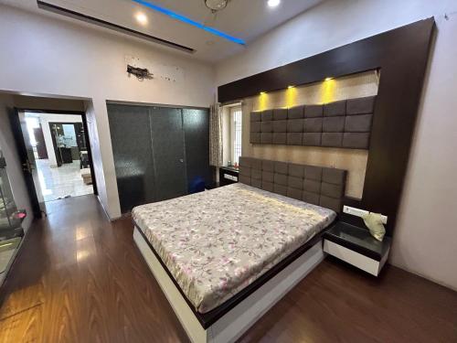 a bedroom with a large bed in a room at Rukmani Kunj in Varanasi