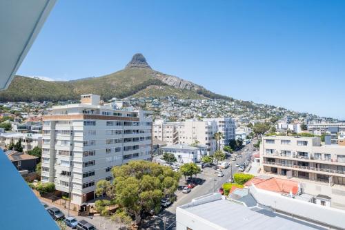 a view of a city with a mountain in the background at The Tropicana Hotel in Cape Town