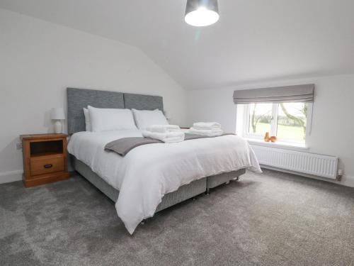 Postel nebo postele na pokoji v ubytování Apple Tree Cottage