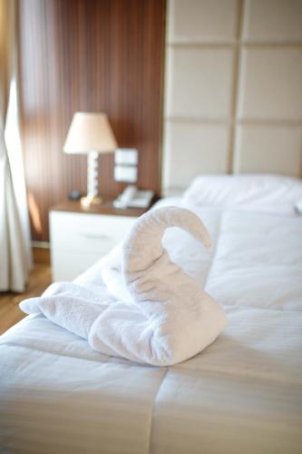 Ένα ή περισσότερα κρεβάτια σε δωμάτιο στο SOLAYA Sunshine inn